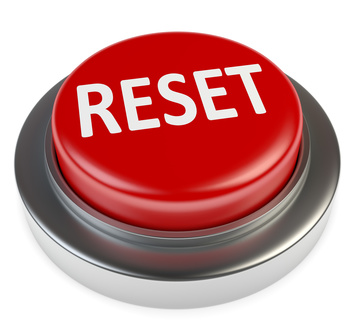 Roter Knopf mit der Aufschrift „RESET“